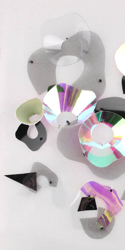 Embroidered iridescent spots created by Invenio Flory